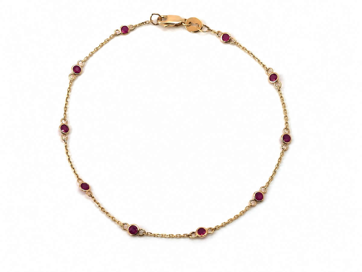 Pulsera de Estaciones con Rubíes en Bisel
